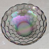 Top angled view of the iridescent Federal Carnival Glass Yorktown bowl showing the bubble pattern and scalloped edge.