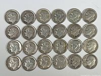 Top-down view of all 24 Roosevelt dimes arranged in a grid, showing obverse side with Roosevelt's profile.