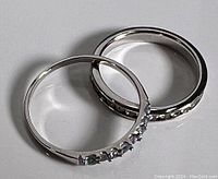 Two sterling silver rings placed side by side on a white background, showing front and side views.