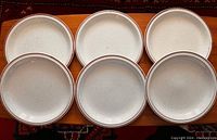 Set of 6 speckled ceramic dinner plates arranged in two rows of three.
