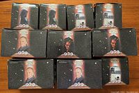 Ten Star Wars Episode I Phantom Menace Pizza Hut promotional toy boxes arranged showing front designs with character images such as Darth Maul and R2-D2. Most boxes sealed.