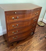 Front angled view showing overall design, drawer shape and finish