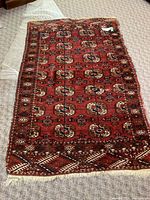 Full view of kilim carpet showing overall pattern, shape, and wear.