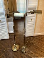 Front view of both lamps showing overall appearance, adjustable arms, and base