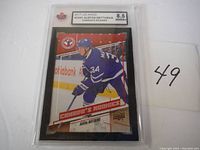 Photo of 2017 Upper Deck NHL Canadas Rookies Auston Matthews rookie card graded 8.5 NMM+, showing front of card in protective slab.