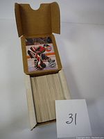 Box of 1991/92 Pro-Set Platinum hockey cards showing a large stack held upright inside a cardboard box labeled '31'.
