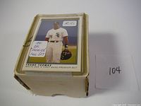 Top view of a plain box holding a stack of 1991 OPC Premier baseball cards, with a Frank Thomas rookie card on top labeled R.C.