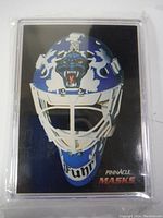 Clear view of the hockey card showing Grant Fuhr's goalie mask, sealed in a protective sleeve with 'Pinnacle Masks' logo.