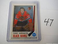 Front view of the Tony Esposito rookie card from the 1992 Anniversary Series showing the player in Black Hawks goalie uniform and card branding details.