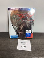 Front cover of the 300 Blu-ray Digibook showing Spartan helmet artwork and included digital copy sticker.