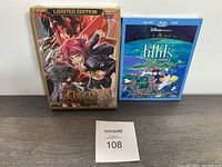 Photo of two sealed anime media items: Code Geass DVD set and Kiki's Delivery Service Blu-ray/DVD combo