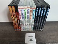 Front row of DVD cases from the lot showing Rurouni Kenshin, One Piece, Chobits (volumes 1-7, volume 6 missing), and Yu Yu Hakusho series.