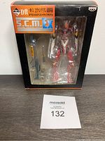 Front view of boxed Banpresto Evangelion EVA-02 action figure showing figure and accessories through clear window and box condition