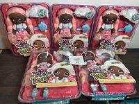 Five Na! Na! Na! Surprise Teens Series 2 Lila Lamb 11-inch soft dolls in original packaging displayed on a table.