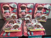 Five Na! Na! Na! Surprise Teens Series 2 Lila Lamb 11-inch soft dolls in original packaging, each with accessories visible.