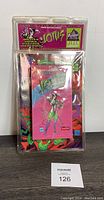 Front view of sealed Todd McFarlane's Lotus VHS Bonus Spawn #1 in original clamshell packaging with vibrant artwork and text.