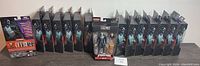 Wide shot showing all 15 Hasbro Marvel Legends Spider-Man Morlun action figures in original packaging arranged in a line on a flat surface.
