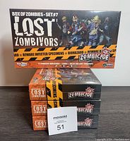 Four sealed boxes of Zombicide Lost Zombivors Box of Zombies Set #7 stacked and shown from front and side angles.