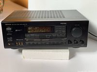 Onkyo TX-SV727 receiver front panel with power button, digital display, and control buttons