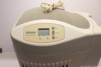 Humidifier top view showing control panel with buttons and power cord