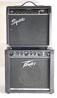 Front stacked view of Squire Champ 15GR on top and Peavey Rage 158 below, showing logos and overall condition