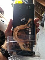 Front side of the NVIDIA 8800 GT 512MB graphics card showing the cooling fan and model details.