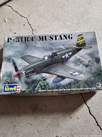 Box cover of Revell P-51B/C Mustang 1:48 scale model kit with airplane artwork