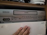 Front view of Emerson DA-HEAD VHS player showing front panel controls and input ports.