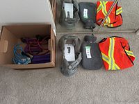 Exercise equipment including resistance bands, ankle or wrist weights, ankle braces, safety vest, and hot water bottle