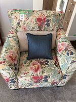 Front view of floral patterned chair with both cushions in place