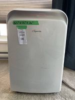 Front view of unit showing full housing and taped dimensions label