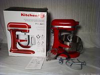 Mixer, bowl, attachments, manual and box arranged