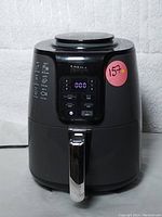 Front view of the black Ninja Air Fryer AF10 Series S5 powered on with digital display showing 0:00 time and control buttons visible.