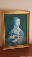 Full view of framed print showing Lady with an Ermine artwork and gold frame.