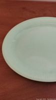 Full top view showing oval shape and uniform jadeite glass finish with fine ribbed border