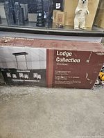 Photo of the boxed light fixture showing brand, model, and key features