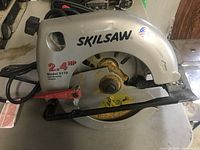 Side view of Skilsaw 2.4 HP circular saw, model 5175, showing blade guard, handle, and power cord.