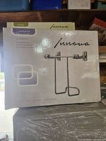 Boxed Innova wall mount magazine rack in Jameson series, showing product image and packaging