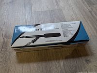 Closed box with the Apex 175 microphone graphic and model details on the top, primarily blue and white packaging.