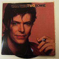 Front cover of the vinyl LP record featuring a close-up portrait of David Bowie holding a cigarette with text 'ChangesTwo Bowie'.