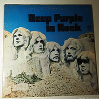 Front cover of Deep Purple In Rock album with stylized Mount Rushmore and band faces