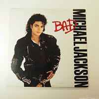 Front cover of Michael Jackson's Bad vinyl LP album showing artist portrait and title.