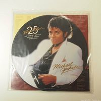 Front of picture disc vinyl with Michael Jackson image and gold lettering