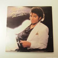 Front cover of Michael Jackson Thriller album showing artist portrait and title.