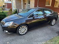 Left side view showing body panels and alloy wheels