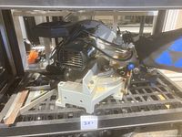 Side view of Delta compound miter saw showing motor, base, and cutting mechanism with visible surface rust.