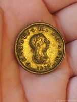 Obverse of 1807 copper coin showing profile of King George III, inscriptions and date.