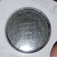 Obverse side showing multi-story building and 'Province of Canada 1844 Montreal' inscription