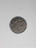 Reverse side showing the denomination and year within wreath design.