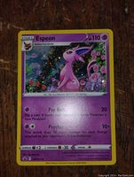 Front image of Espeon holo Pokemon card showing the character, attacks, and holographic background.
